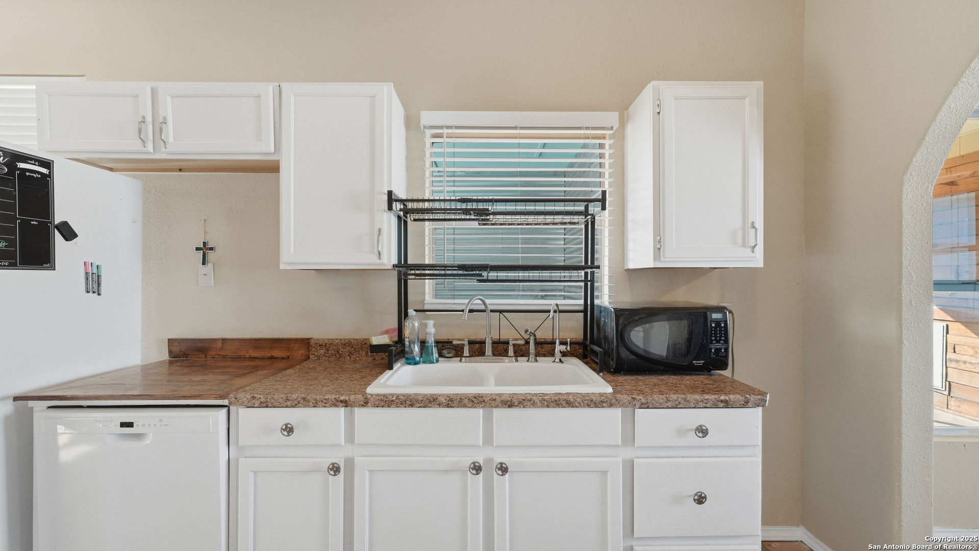 331 Rangeland Road Blanco, TX 78606 - Photo 30 of 49 a kitchen with granite countertop a sink and a stove