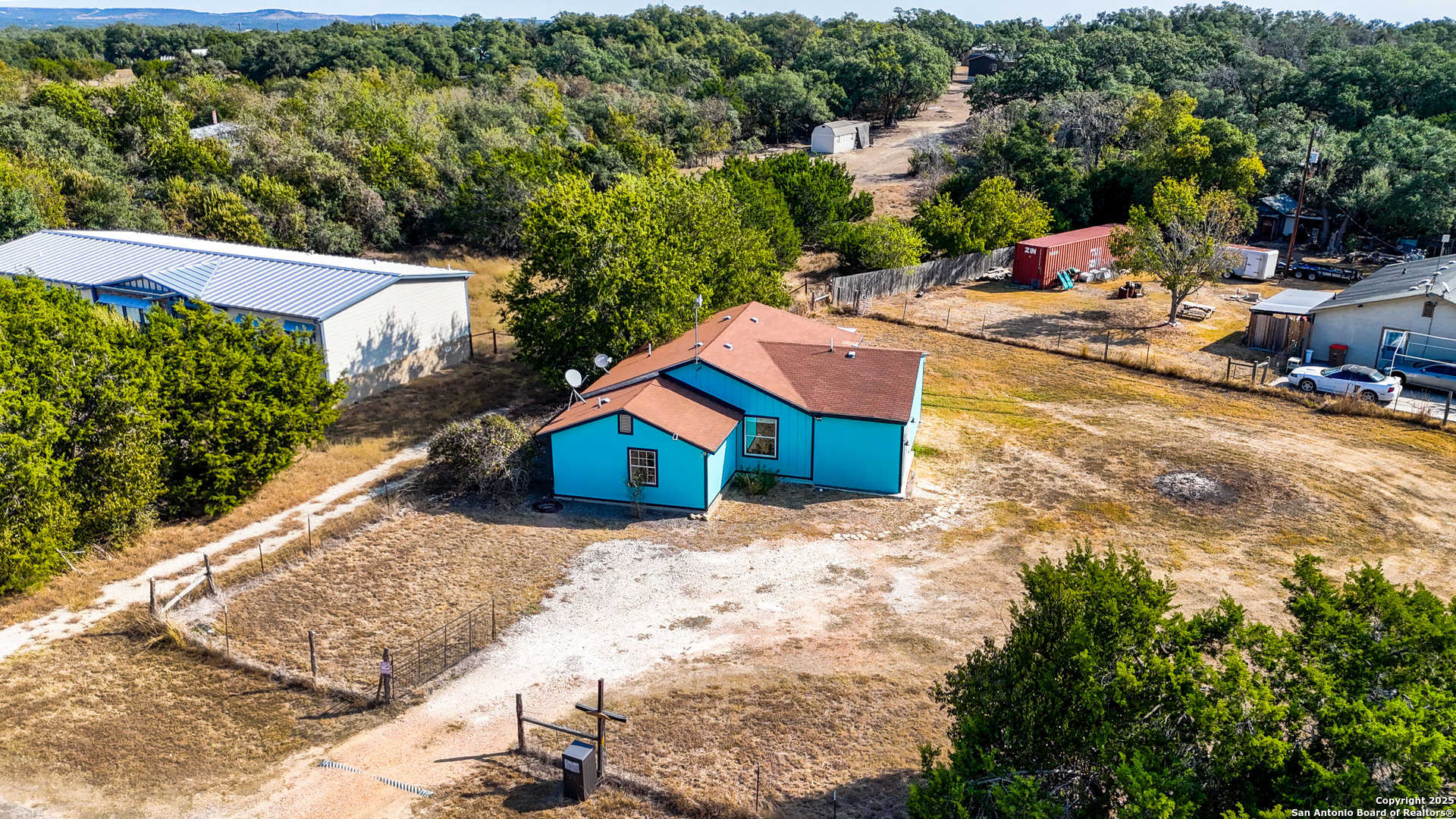 331 Rangeland Road Blanco, TX 78606 - Photo 3 of 49 a view of a house with a yard