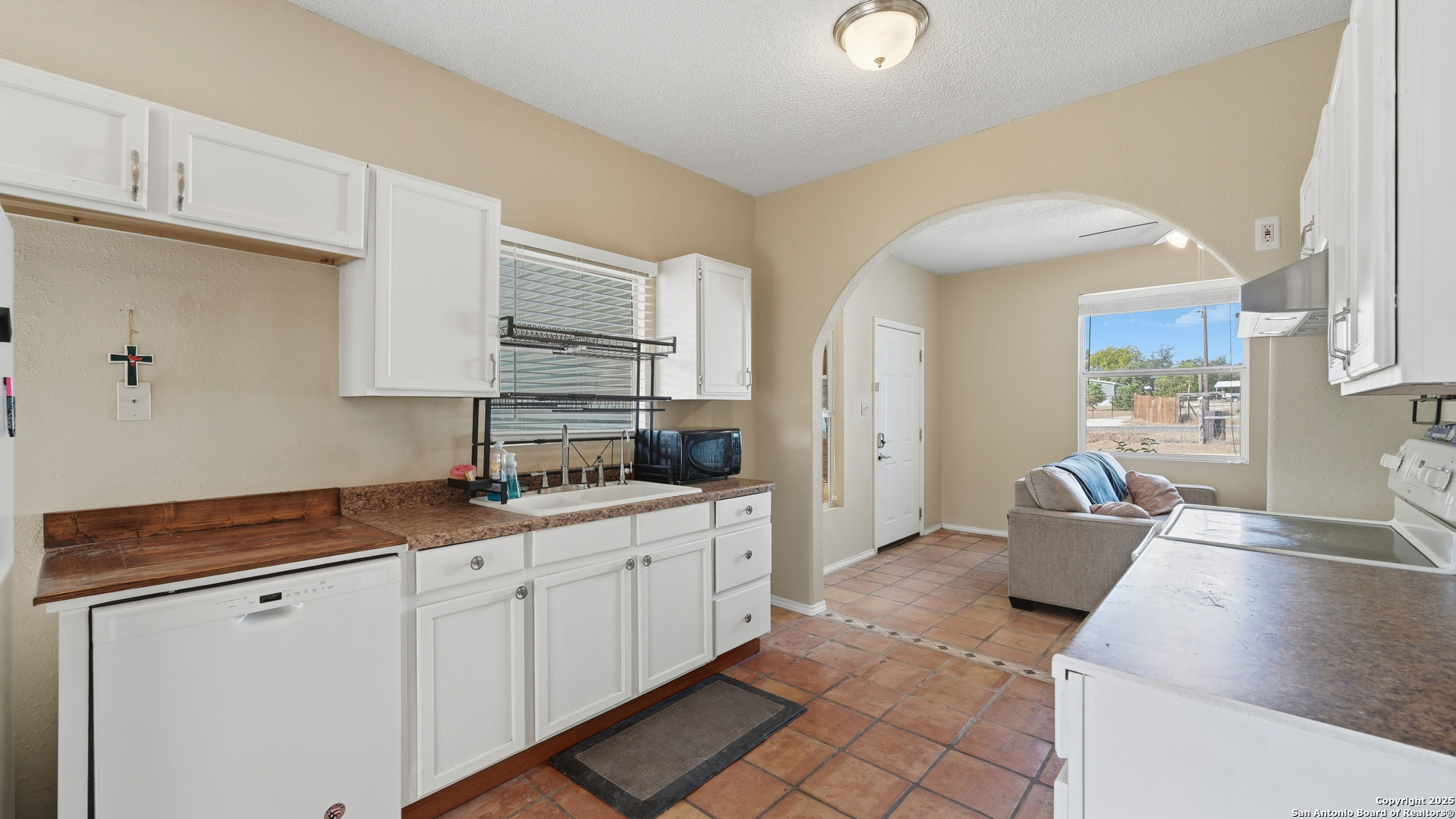 331 Rangeland Road Blanco, TX 78606 - Photo 32 of 49 a kitchen with stainless steel appliances granite countertop a sink and cabinets