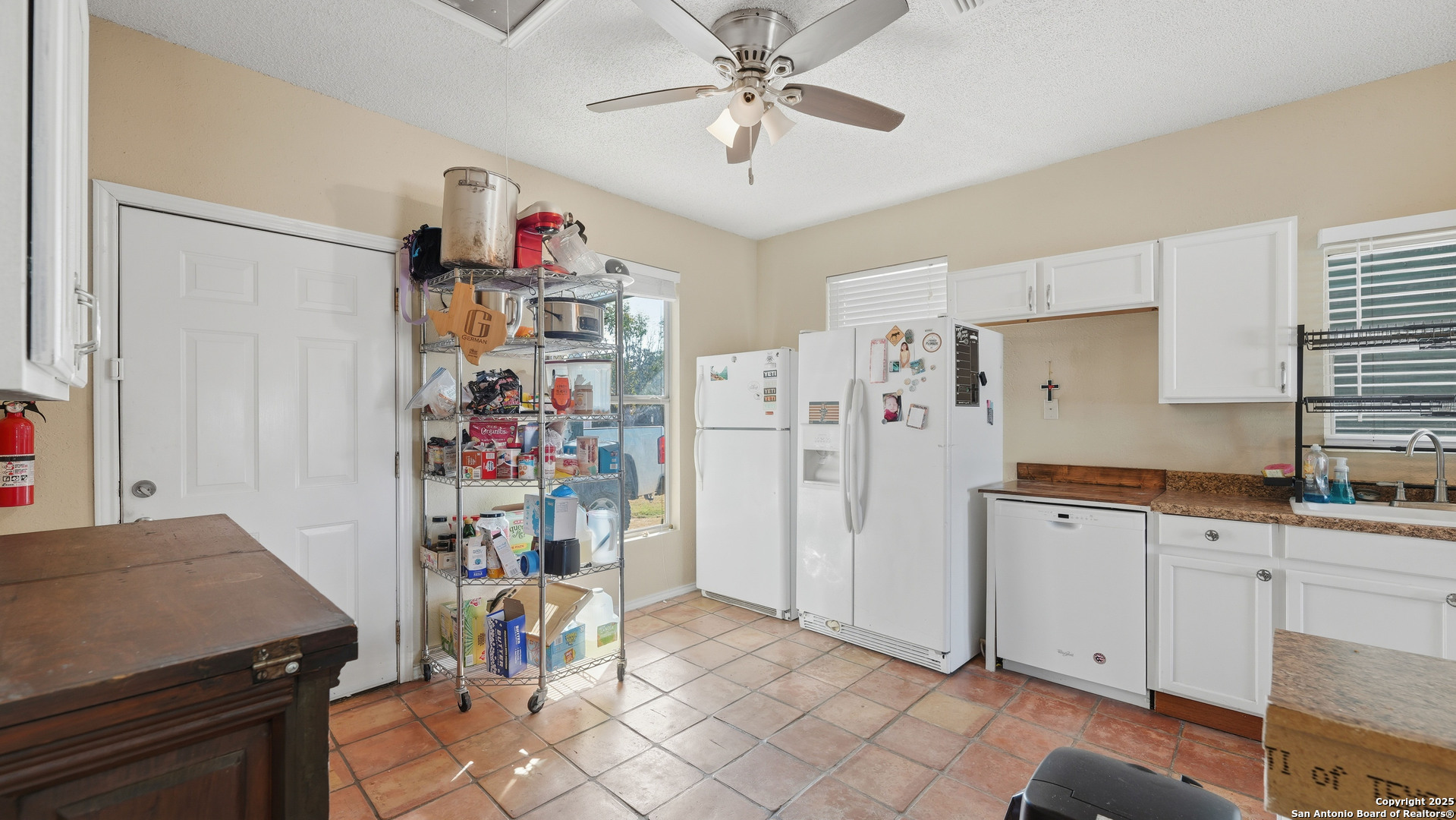 331 Rangeland Road Blanco, TX 78606 - Photo 34 of 49 a view of a kitchen with fridge and workspace