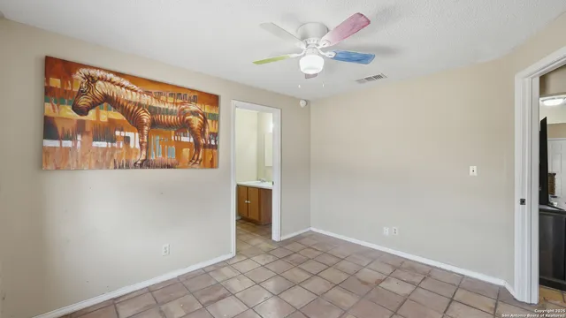 a bathroom with a sink vanity and mirror