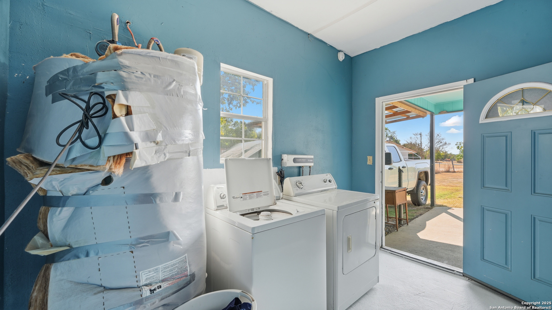 331 Rangeland Road Blanco, TX 78606 - Photo 49 of 49 a utility room with a window dryer and washer