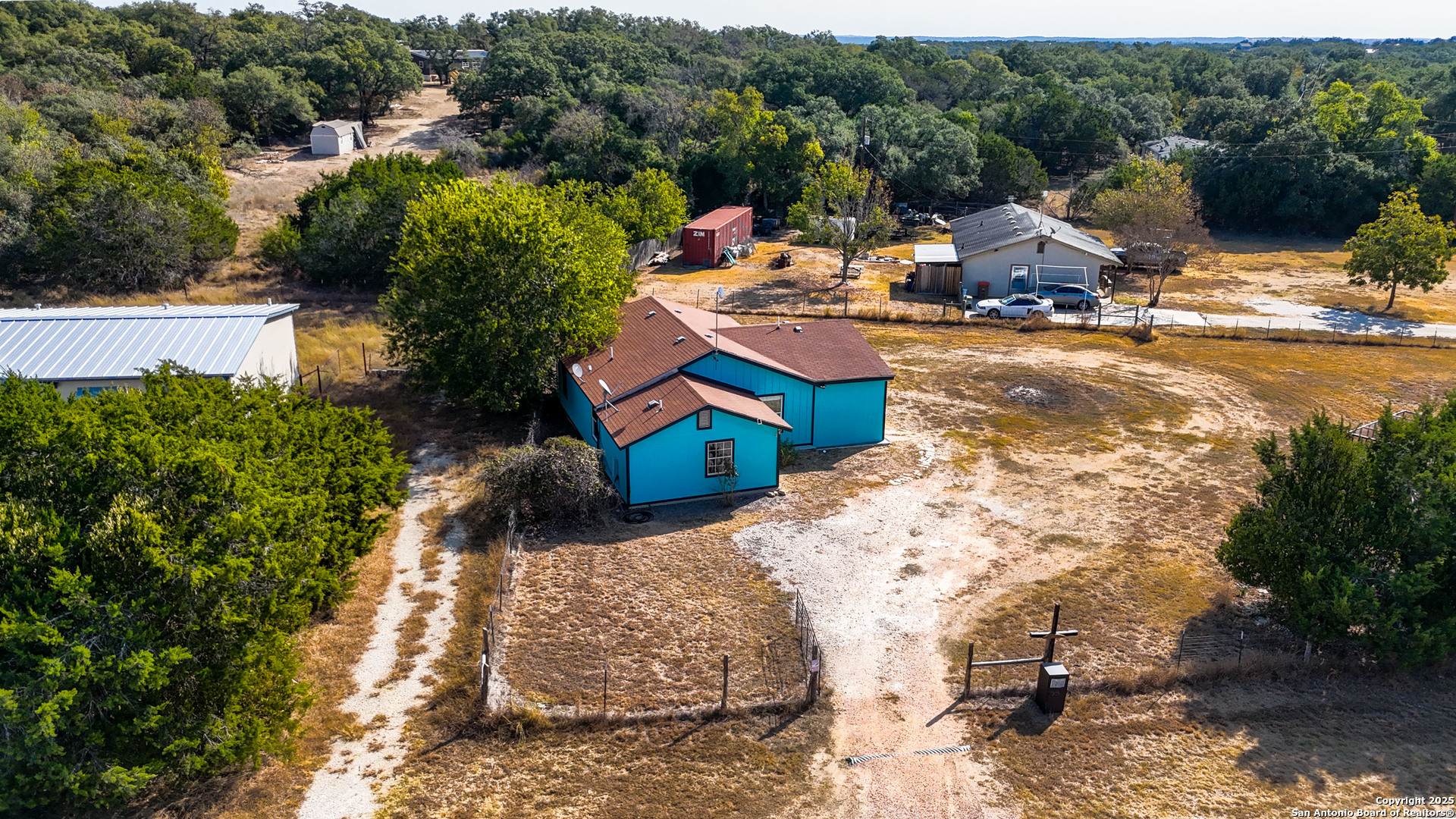 331 Rangeland Road Blanco, TX 78606 - Photo 5 of 49 a view of a lake with a house