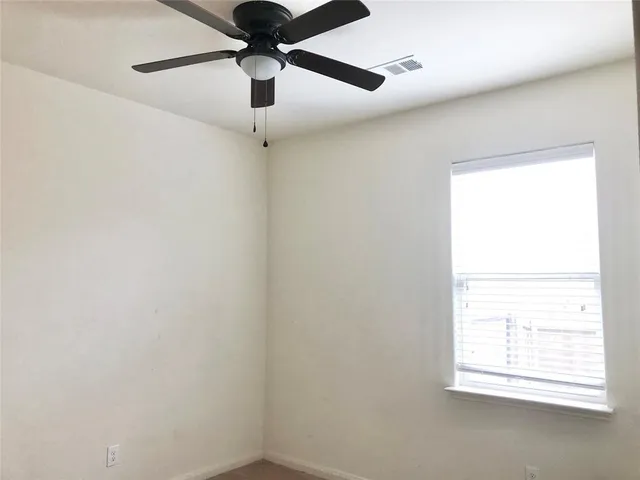 a white toilet and tub sitting next to a bathroom sink