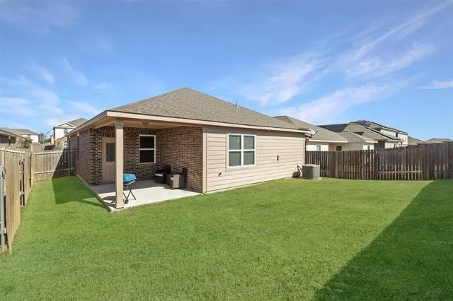 a view of house with backyard and swimming pool