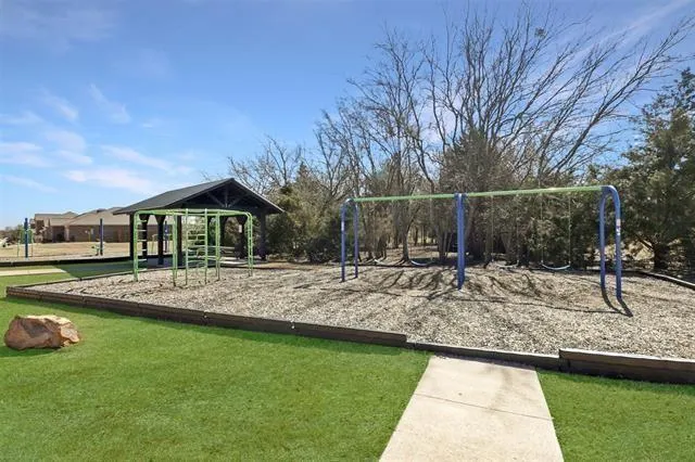 a view of a park with sitting area and garden