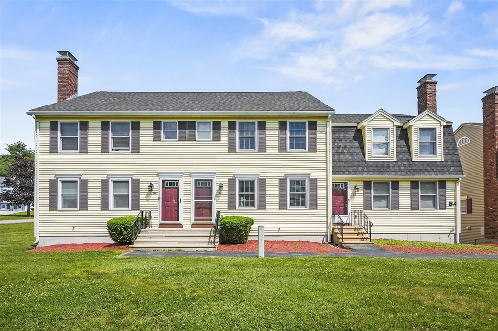 a front view of a house with swimming pool and porch