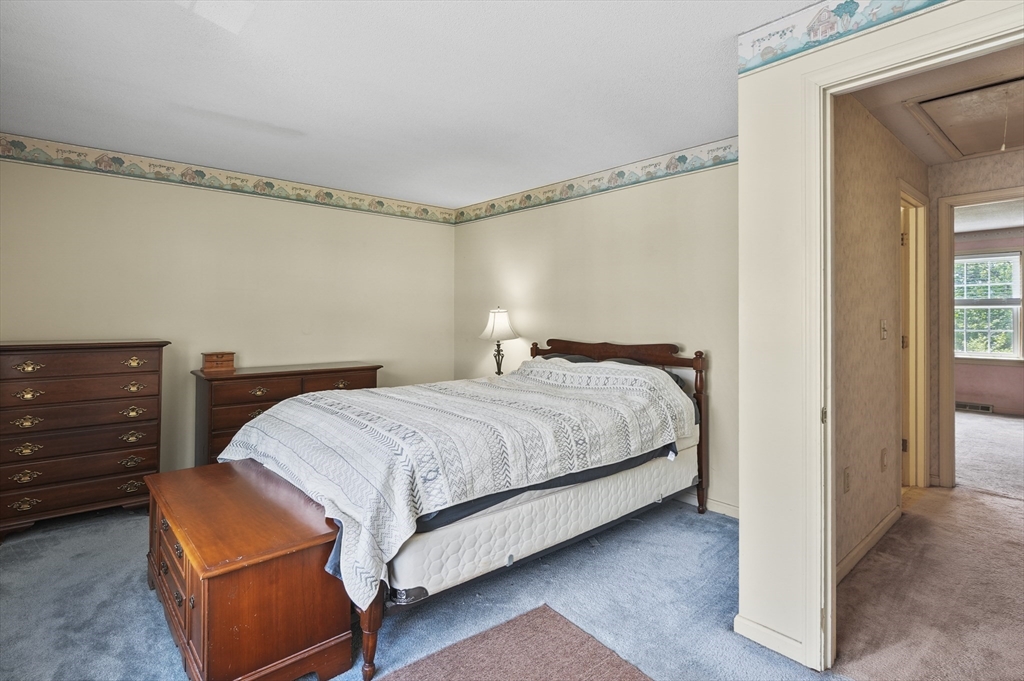 34 Century Way, Unit 34 Gardner, MA 01440 - Photo 13 of 30 a bedroom with a bed and a dresser