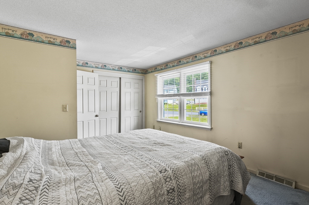34 Century Way, Unit 34 Gardner, MA 01440 - Photo 15 of 30 a bedroom with a bed and a window