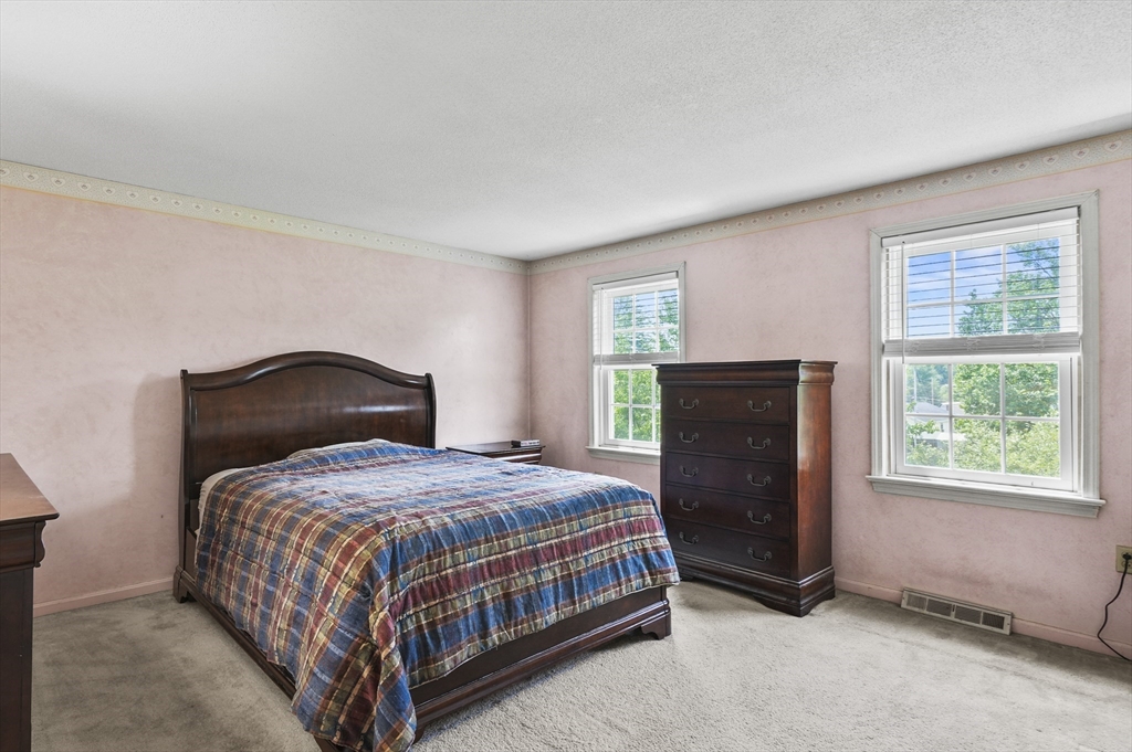 34 Century Way, Unit 34 Gardner, MA 01440 - Photo 16 of 30 a bedroom with a bed and a window