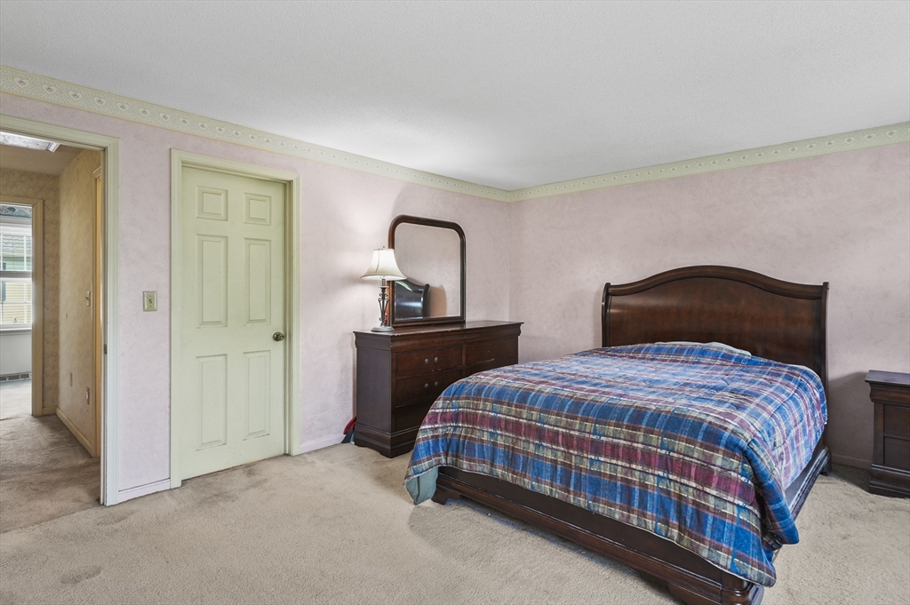 34 Century Way, Unit 34 Gardner, MA 01440 - Photo 17 of 30 a bedroom with two beds and a closet