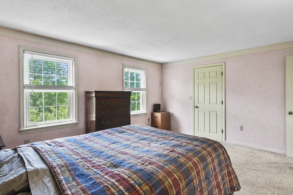34 Century Way, Unit 34 Gardner, MA 01440 - Photo 18 of 30 a bedroom with a bed and a window