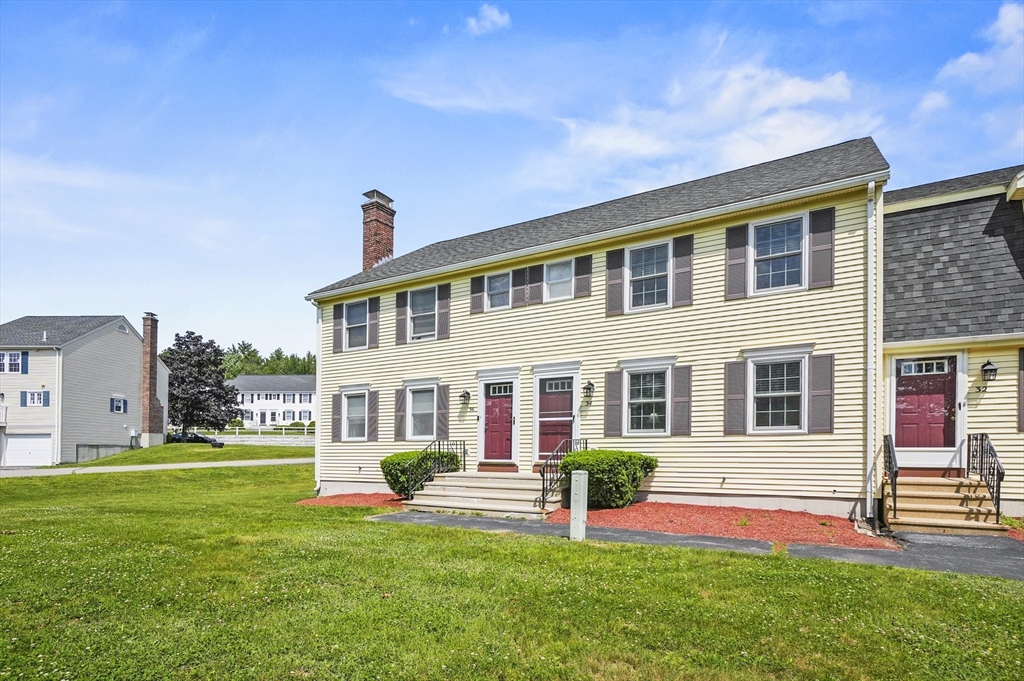 34 Century Way, Unit 34 Gardner, MA 01440 - Photo 21 of 30 a front view of house with yard and green space