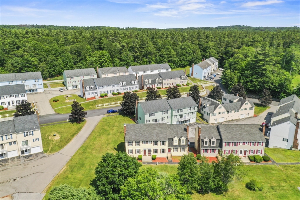 34 Century Way, Unit 34 Gardner, MA 01440 - Photo 28 of 30 a view of a swimming pool with a yard and lake view
