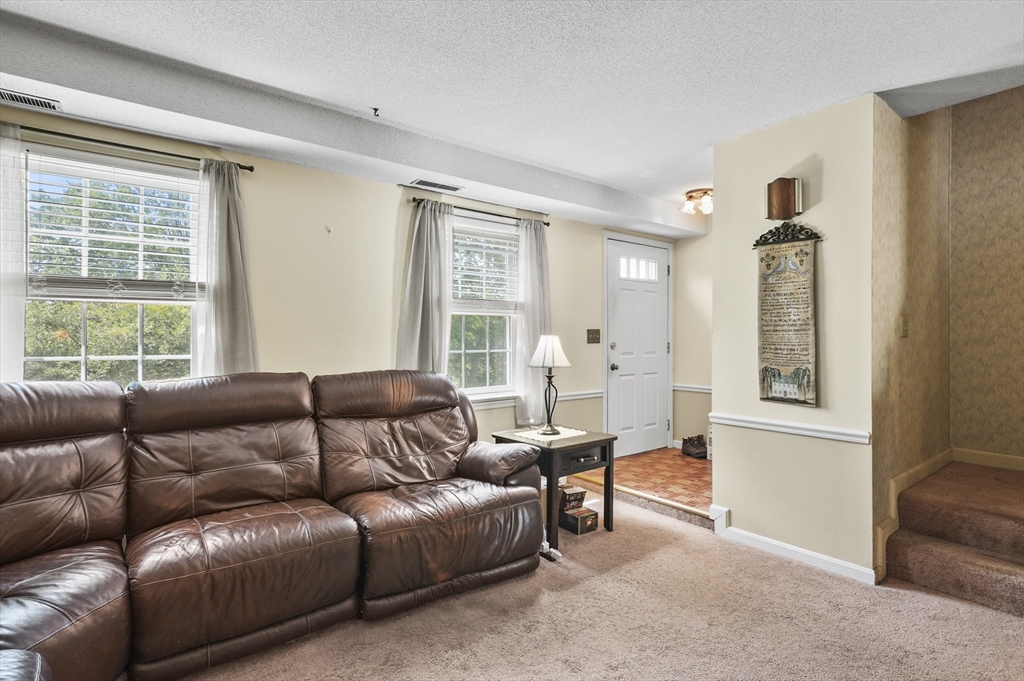 34 Century Way, Unit 34 Gardner, MA 01440 - Photo 3 of 30 a living room with furniture and a window