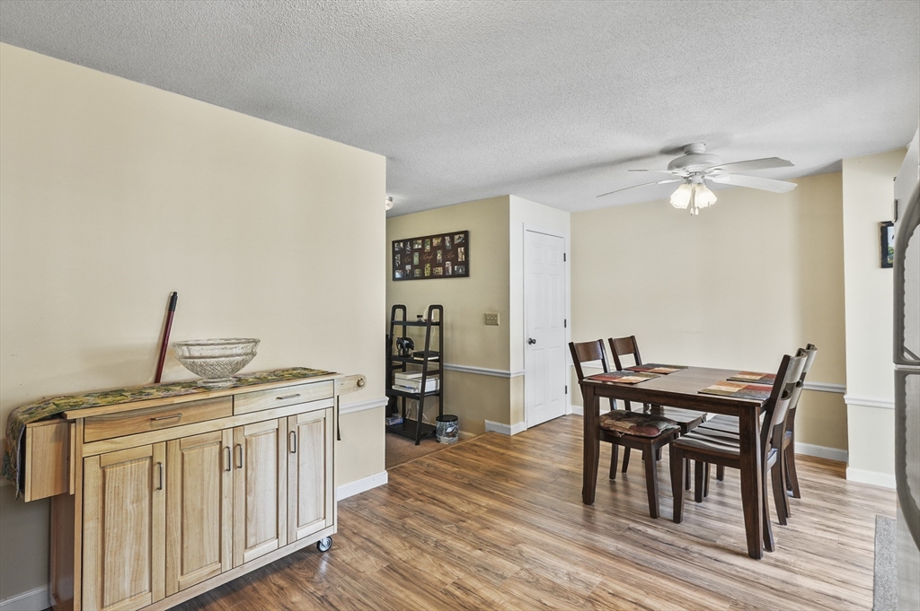 34 Century Way, Unit 34 Gardner, MA 01440 - Photo 7 of 30 a view of a dining room with furniture and wooden floor