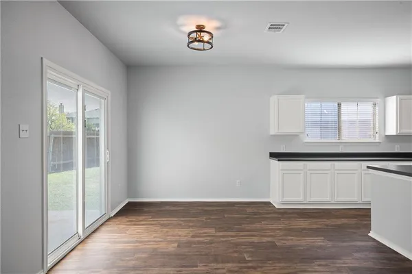a view of a kitchen with a sink and a window