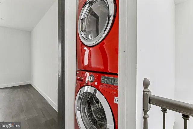 a view of a hallway with washer and dryer