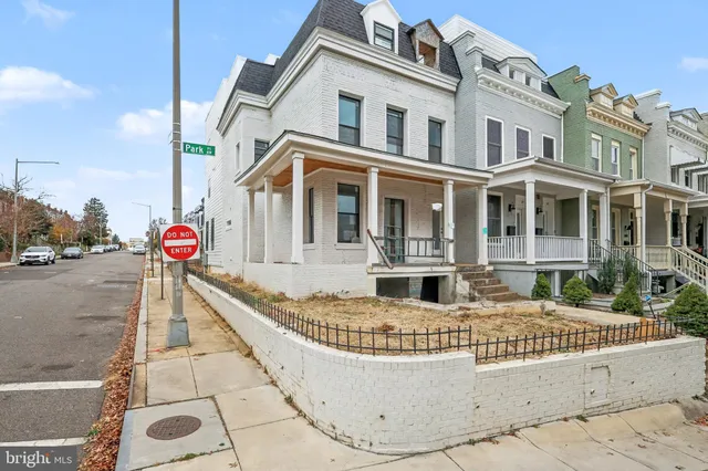 a front view of a house with street