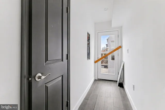 a view of a hallway with stairs