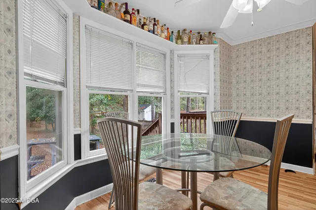 a view of a dining room with furniture window and outside view