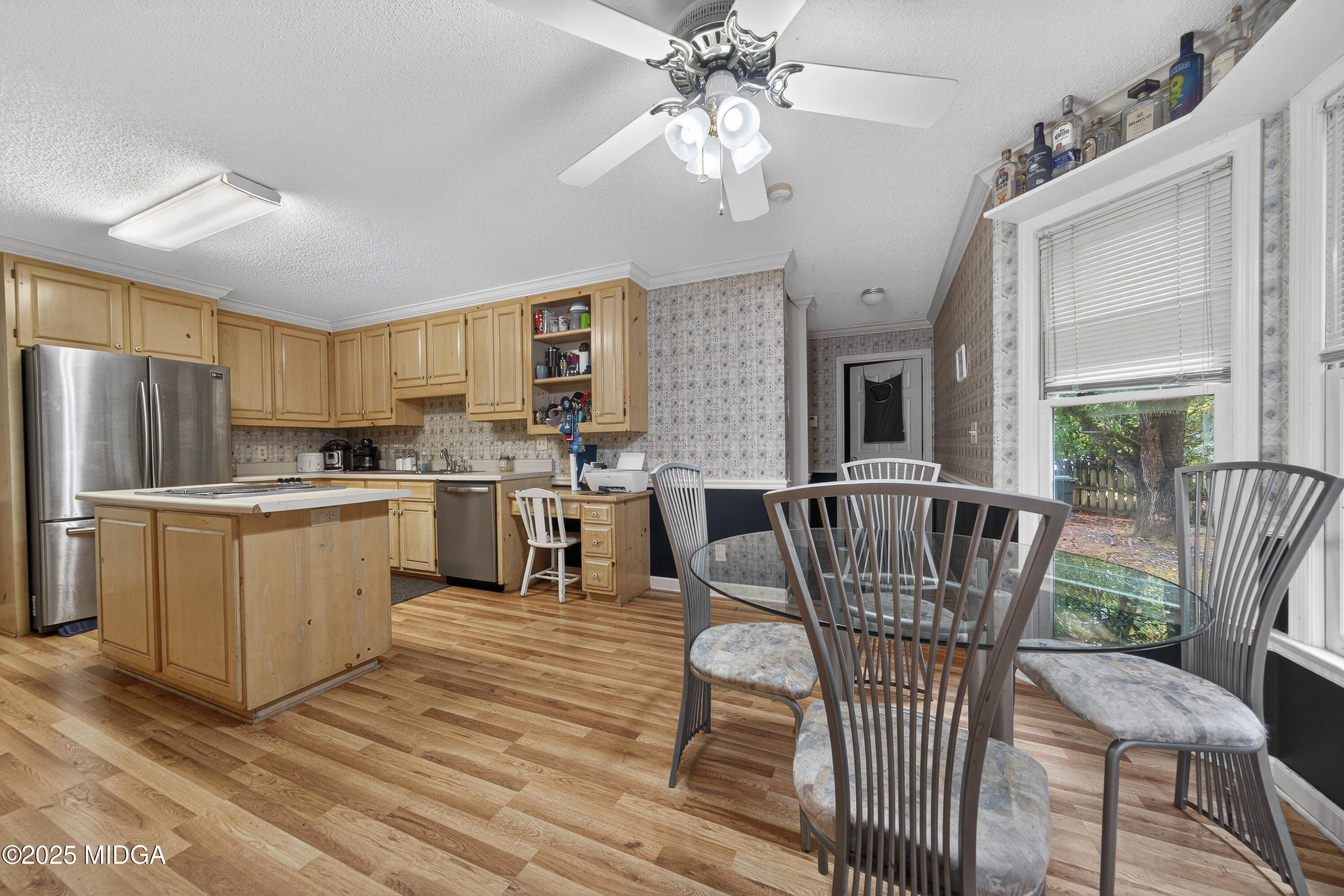 181 Rivoli Landing Macon, GA 31210 - Photo 14 of 37 a kitchen with a dining table chairs and refrigerator