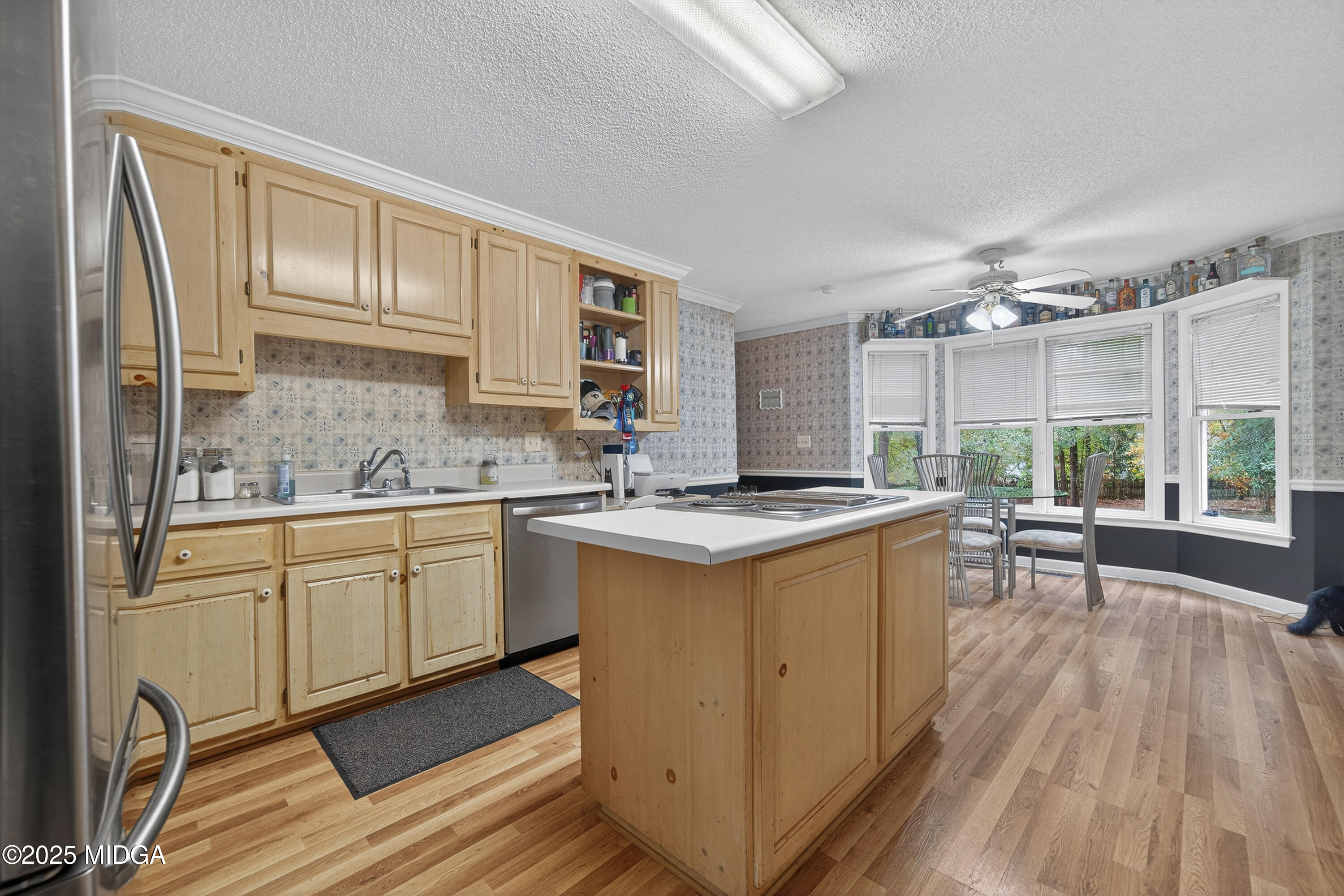 181 Rivoli Landing Macon, GA 31210 - Photo 17 of 37 a kitchen with sink cabinets and wooden floor