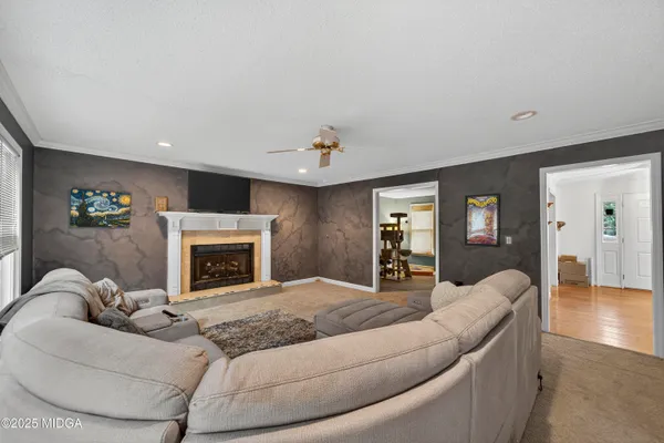 a living room with furniture and a fireplace