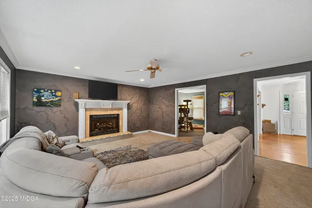 a living room with furniture and a fireplace