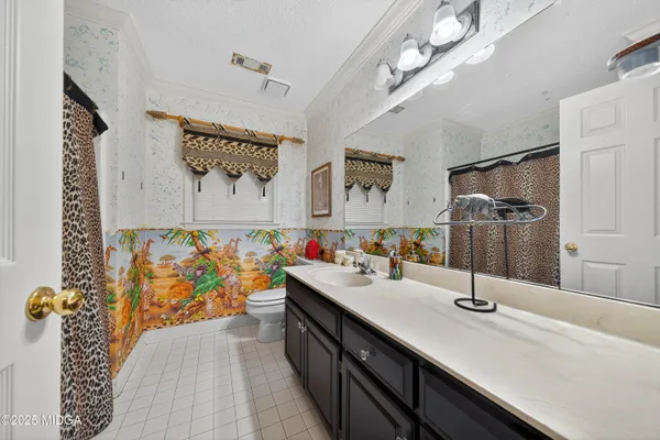 a bathroom with a sink double vanity granite and a shower