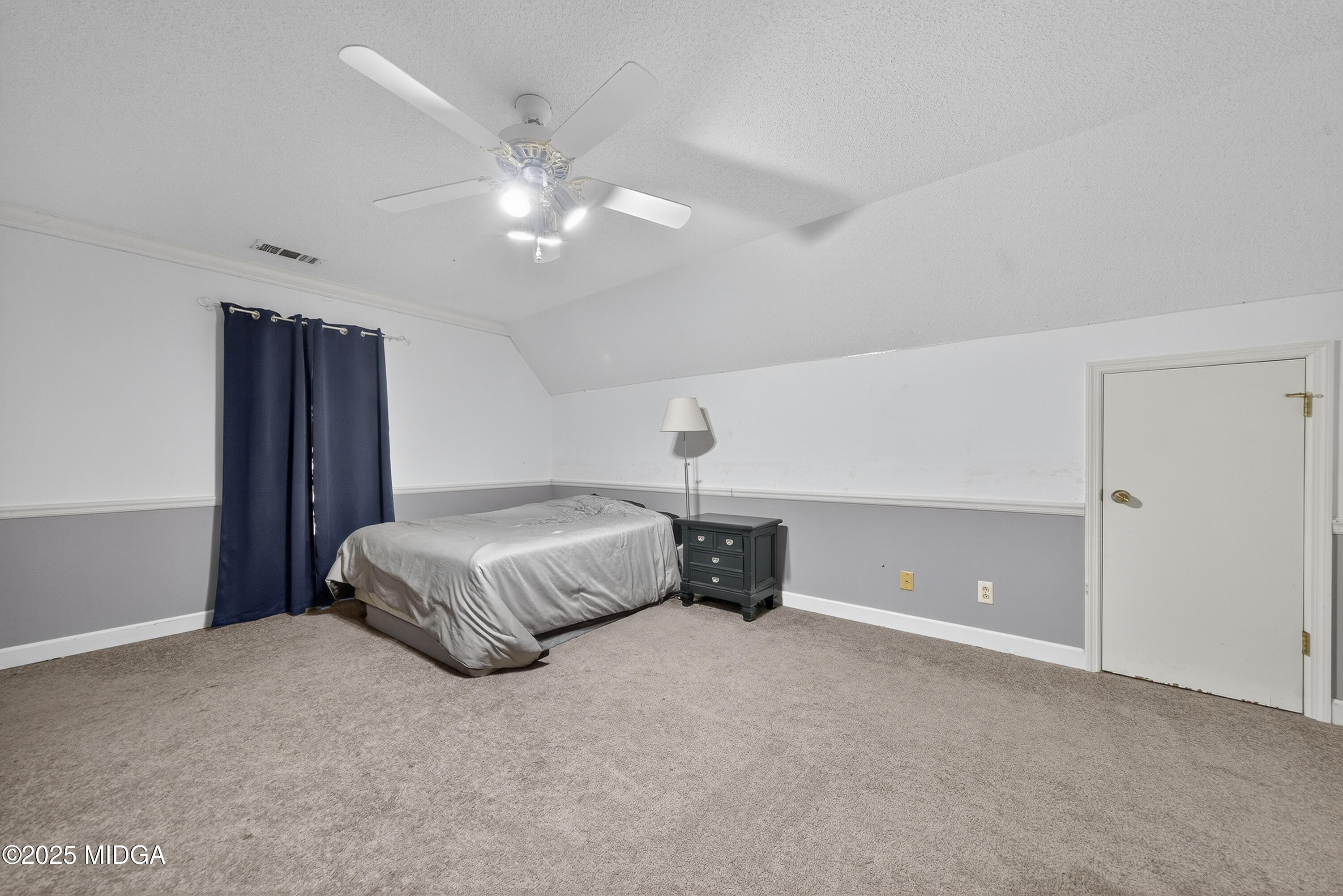 181 Rivoli Landing Macon, GA 31210 - Photo 26 of 37 a bedroom with a bed and a chandelier