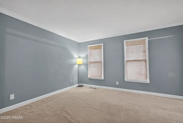 an empty room with windows