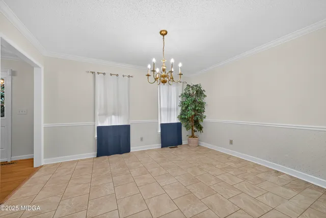 a view of a room with window and flower pot