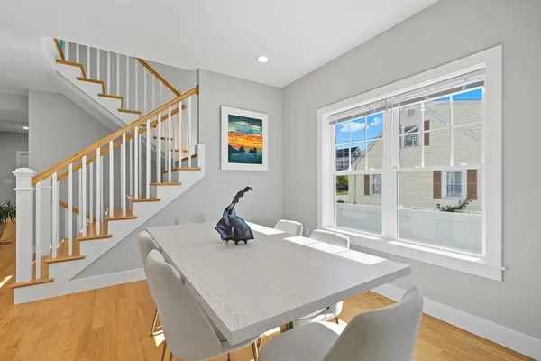 a living room with table and windows