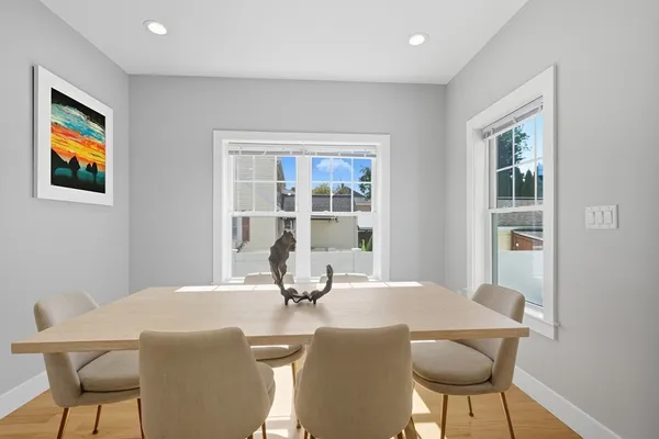 a dining room with a table and chairs