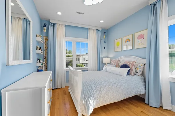 a bedroom with a bed and a couch