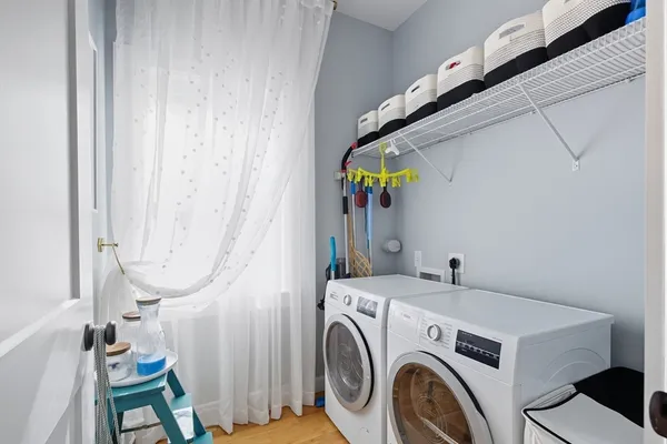 a utility room with dryer and washer