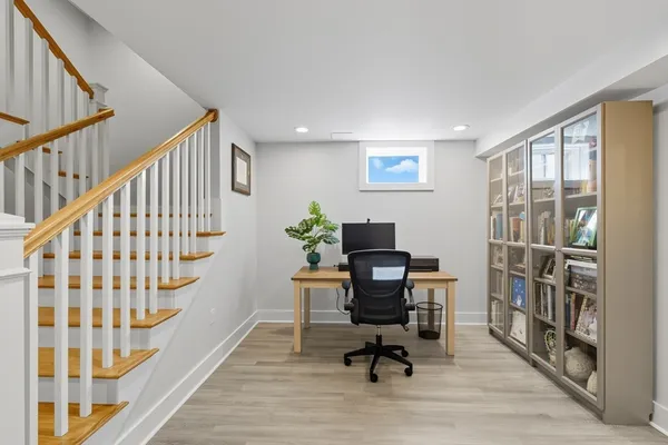 a view of entryway with wooden floor and stairs