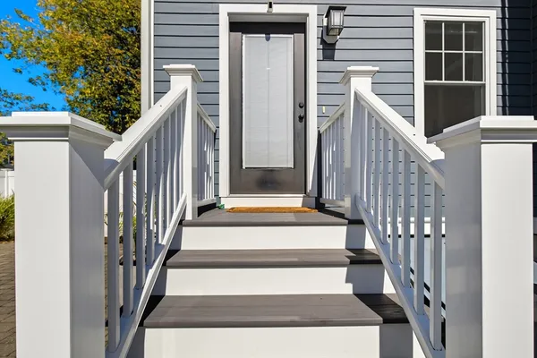 a view of entryway with wooden floor and stairs