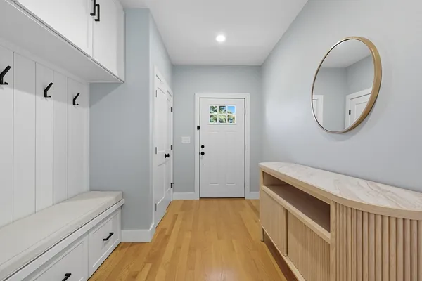 a bathroom with a granite countertop sink a toilet and a mirror
