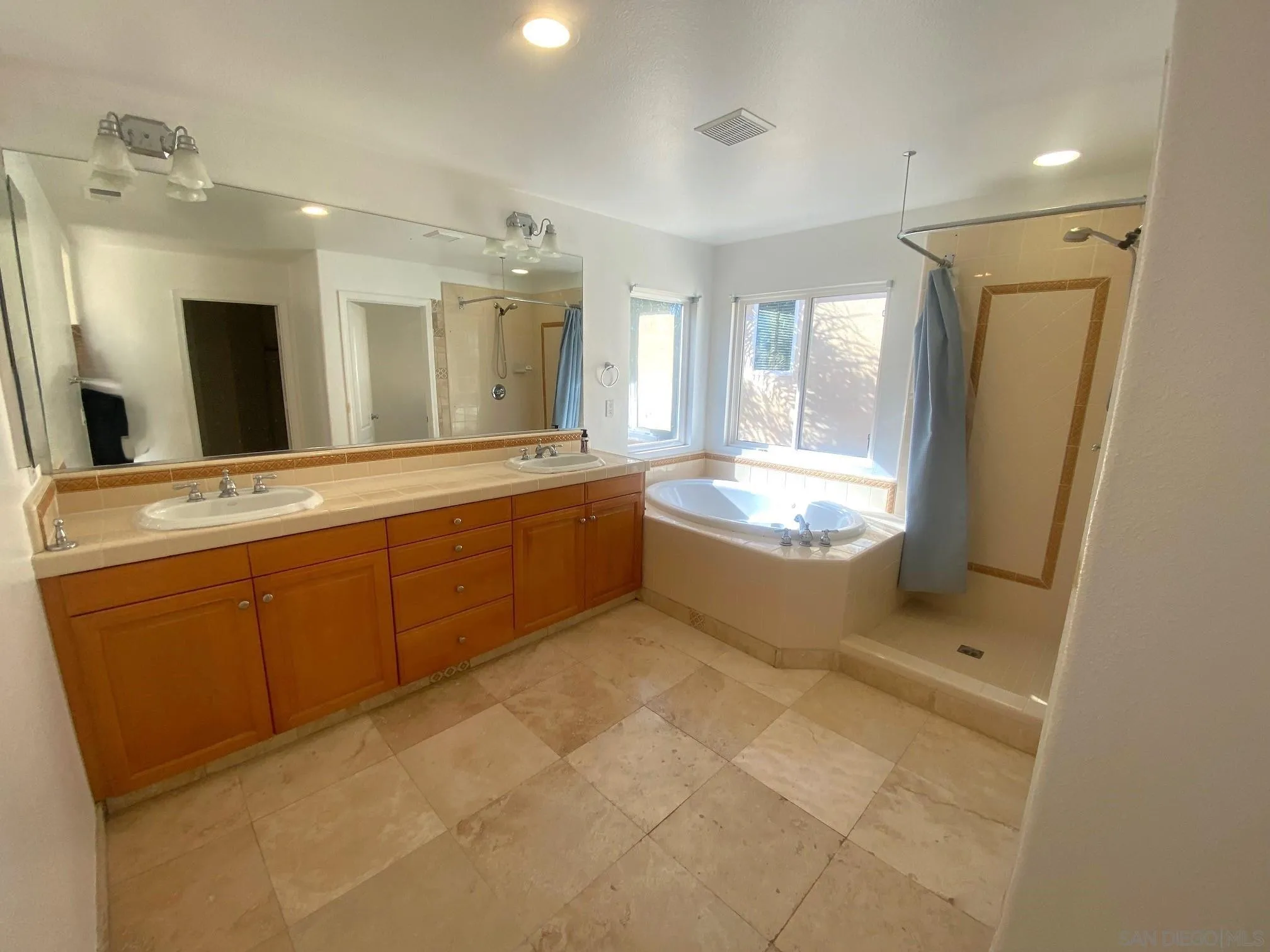 5517 Rabbit Ridge Road San Diego, CA 92130 - Photo 13 of 20 a bathroom with a granite countertop sink a toilet and bathtub