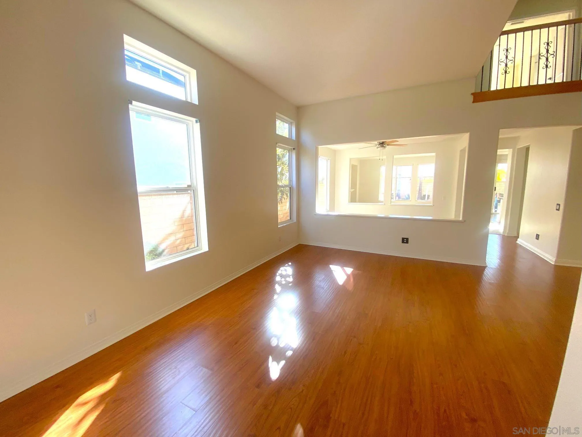 5517 Rabbit Ridge Road San Diego, CA 92130 - Photo 3 of 20 a view of empty room with wooden floor and fan