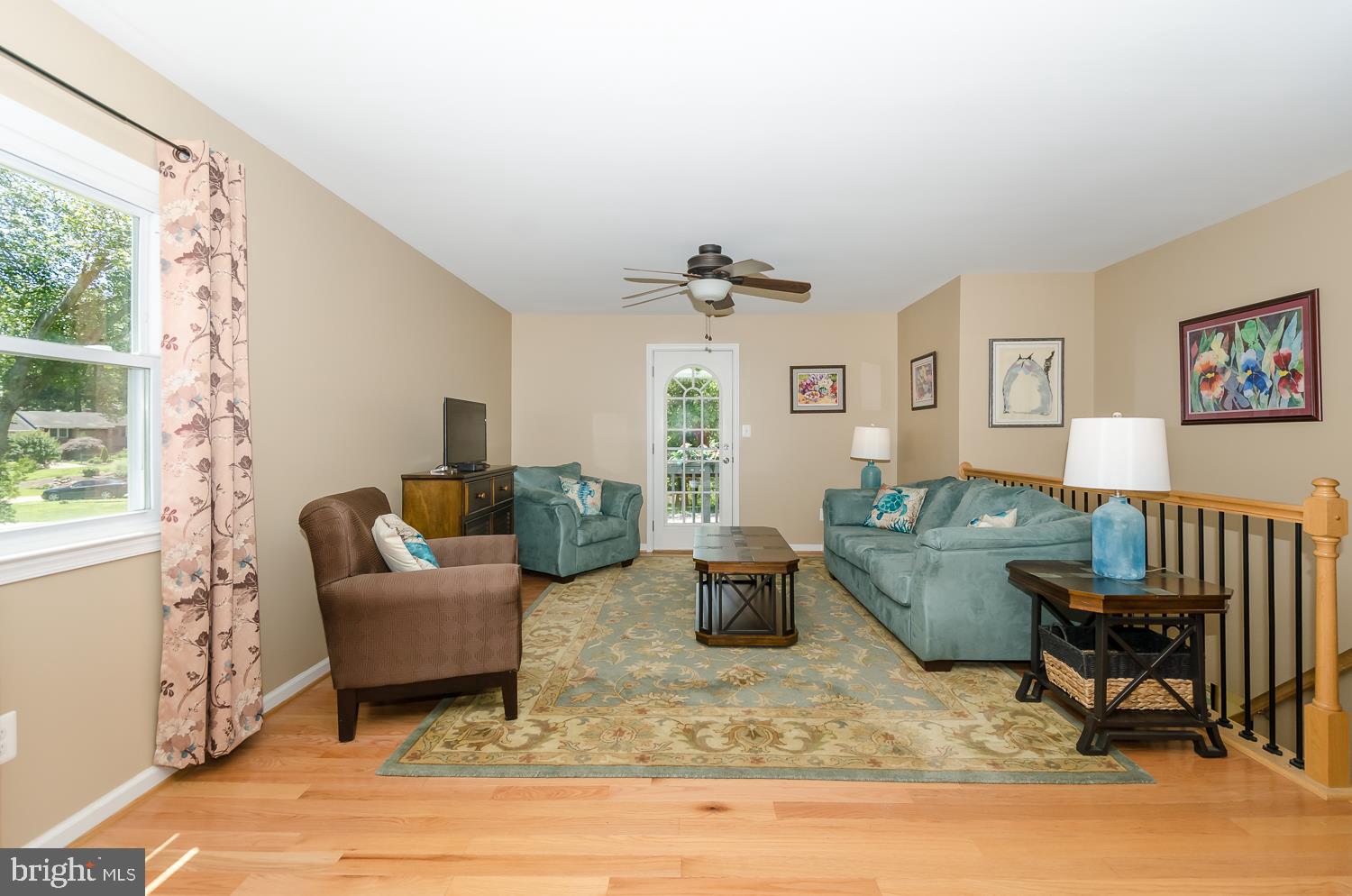 142 Circle Road Pasadena, MD 21122 - Photo 19 of 56 Living Room has door to that beautiful balcony!