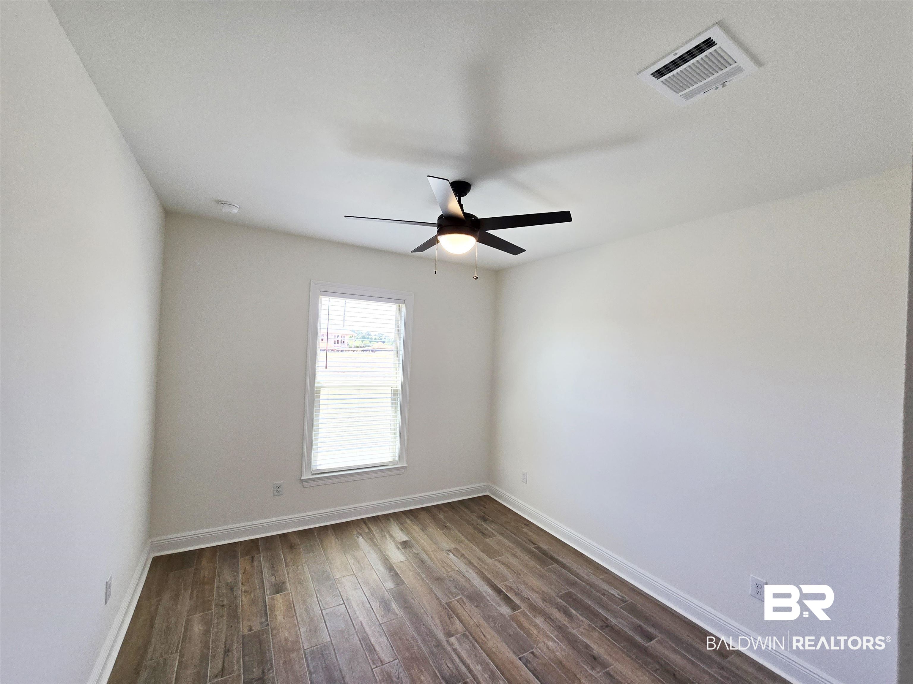 11178 Bonaventure Avenue Daphne, AL 36526 - Photo 15 of 20 Spare room with dark wood-type flooring and ceiling fan