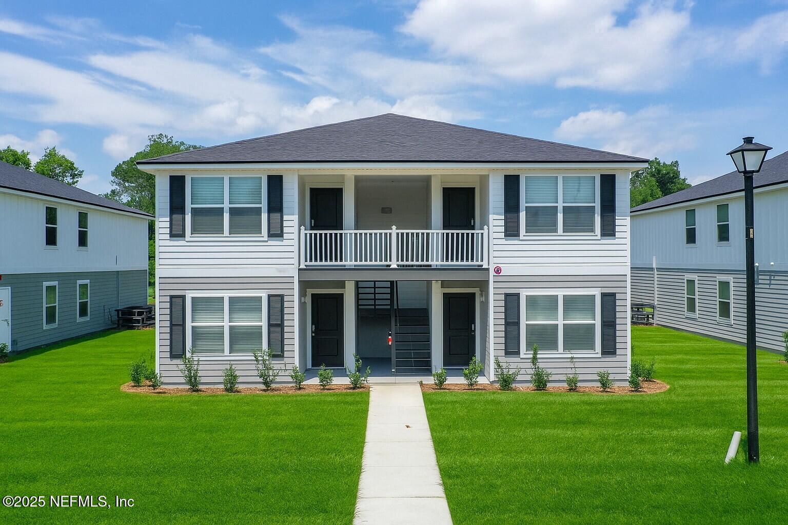 9612 Hood Road Jacksonville, FL 32257 - Photo 1 of 20 a front view of a house with a yard