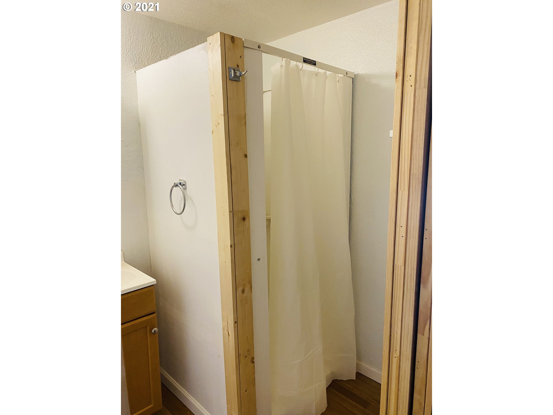 122 Hanna View Lane Riddle, OR 97469 - Photo 9 of 25 a bathroom with a shower and a mirror