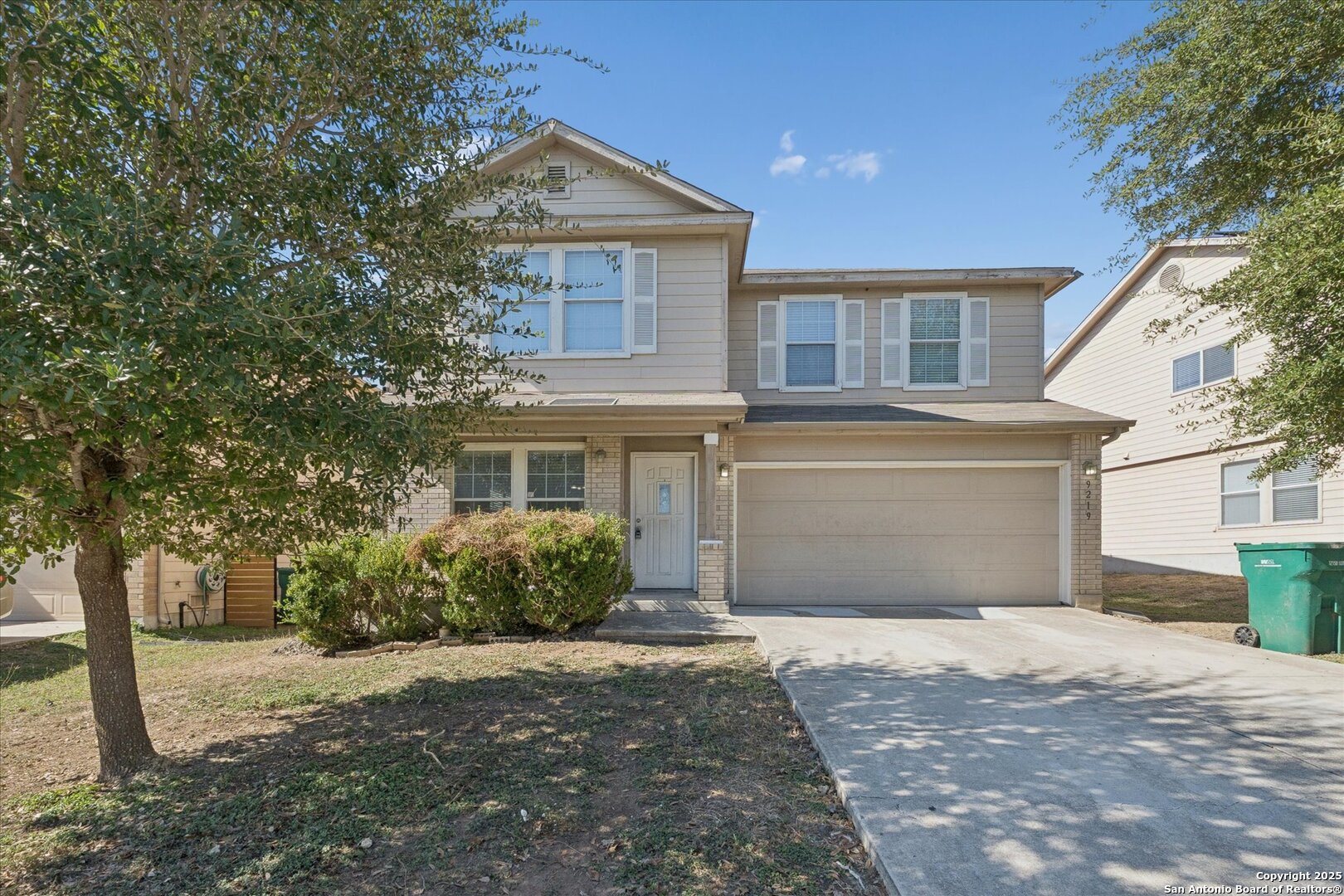 9219 Hanover Cove Converse, TX 78109 - Photo 2 of 46 a front view of a house with a yard and garage