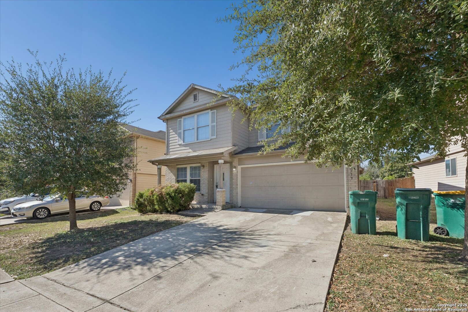 9219 Hanover Cove Converse, TX 78109 - Photo 3 of 46 a front view of a house with a yard and garage