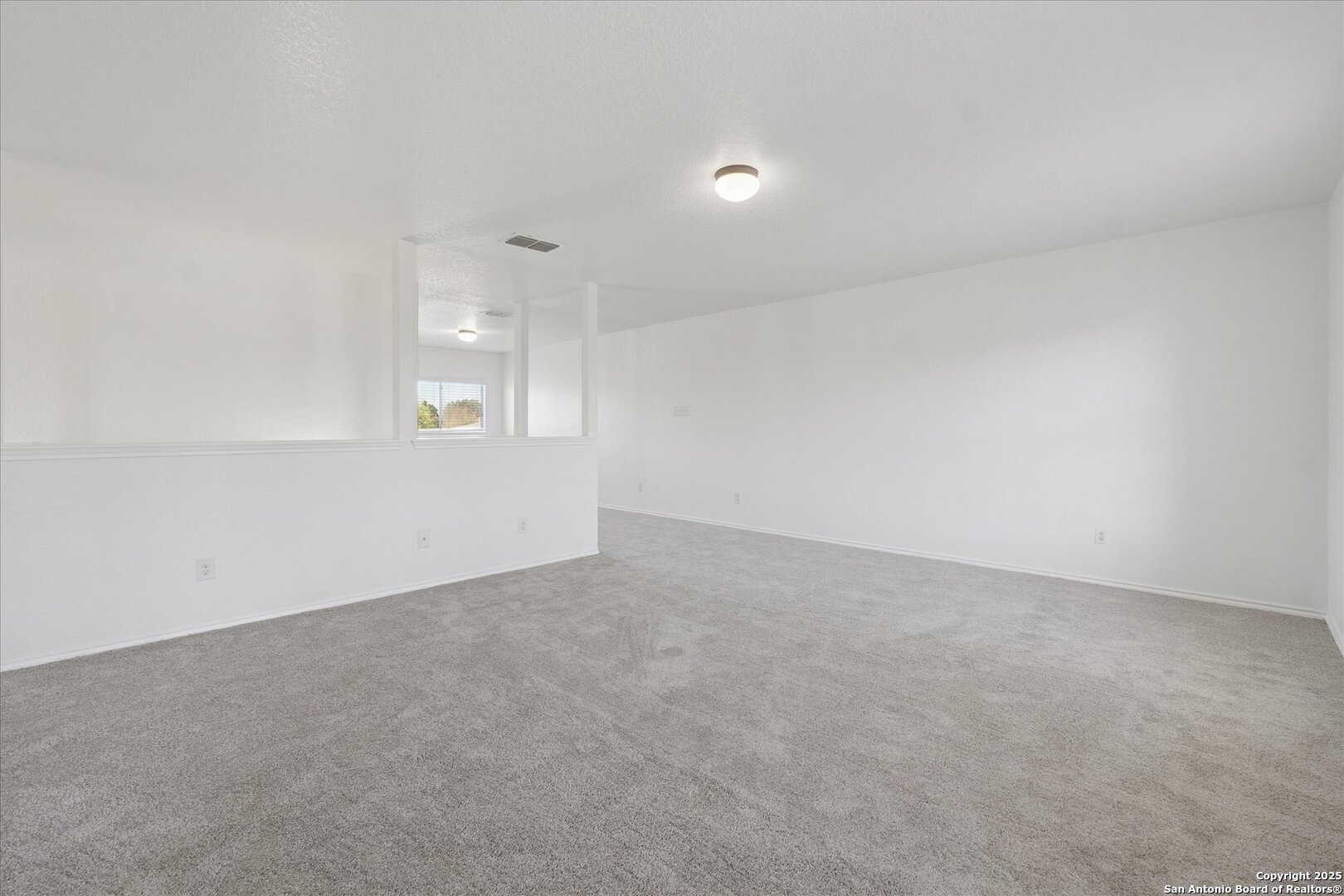 9219 Hanover Cove Converse, TX 78109 - Photo 35 of 46 an empty room with windows and entrance