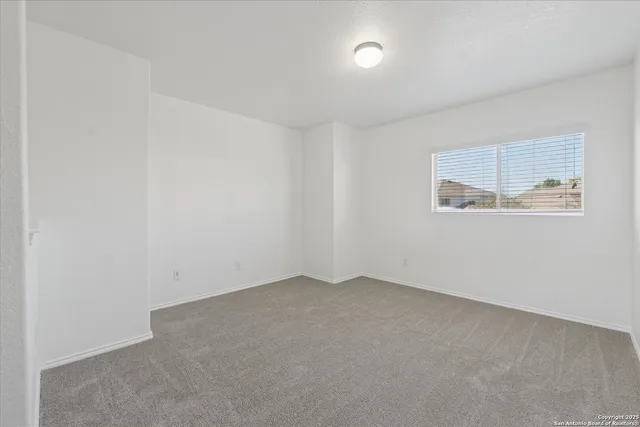 an empty room with a empty space and a window